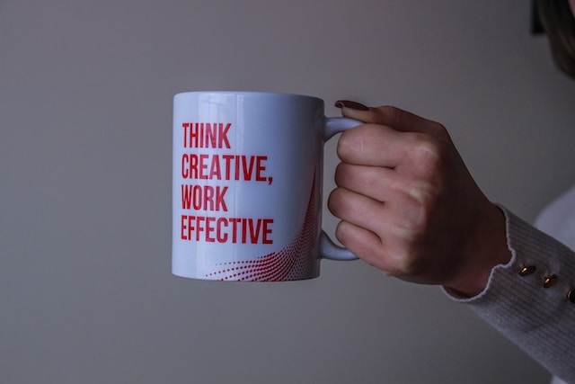 Lady Holding White & Red Mug