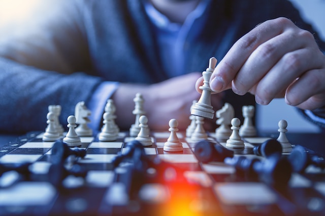 Man Playing Chess - Create A Content Strategy