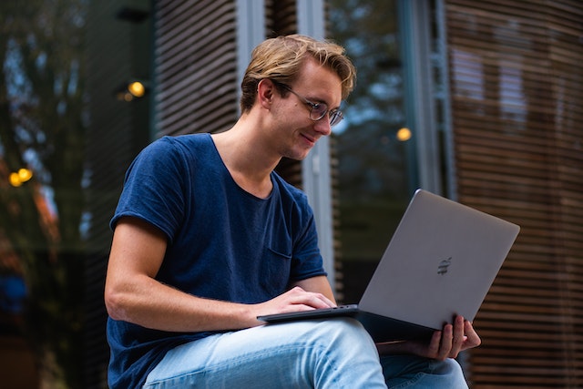 Man on Computer Outside