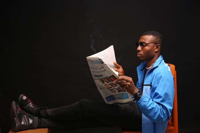 Man Reading Newspaper - How to Write a Press Release