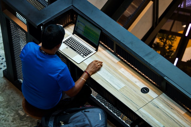Man Using Laptop To Create Content Marketing Plan
